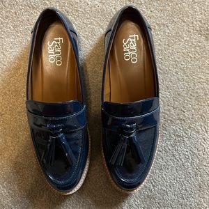 On trend blue patent loafers with tassel and lug sole